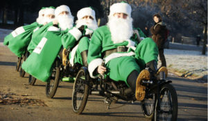 Who needs Rudolph when you have pedal power? This weekend Together.com is sending its team of Green Santas round the country to help people make a difference to climate change this Christmas. PRESS ASSOCIATION Photo.  Picture date: Thursday December 13, 2007. For three days the Together Green Santas will be giving out presents to lucky shoppers in London, Birmingham and Manchester, including amazing energy-saving kettles and packs of Christmas Tree seeds. More seasonal climate-frendly products and ideas can be found www.together.com. It's easy to deal with climate change it we do it Together.  Photo credit should read: David Parry/PA Wire